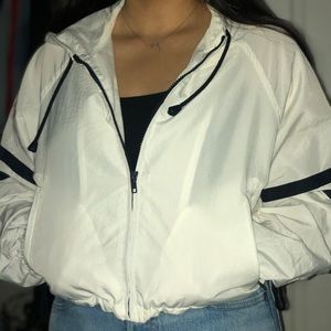 white cropped wind breaker ish jacket